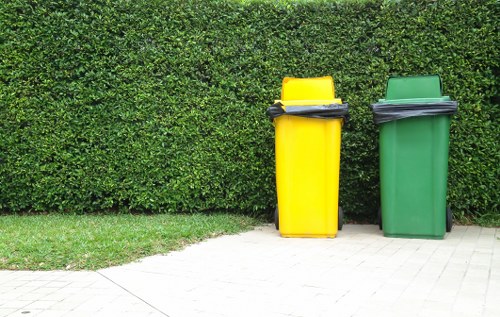 Employees handling business waste in an office